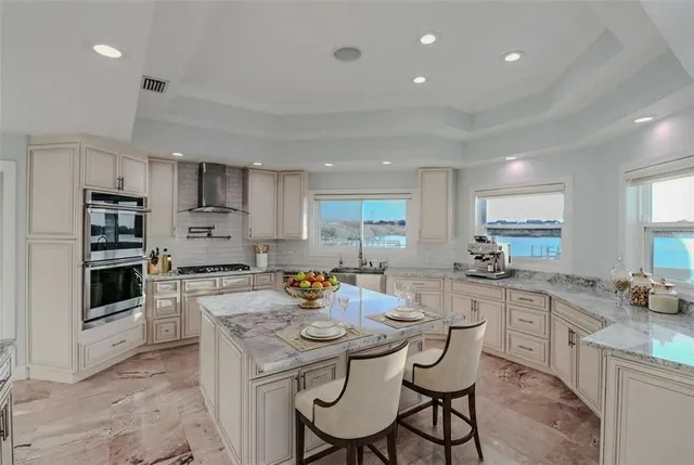 a view of staircase with railing and white walls
