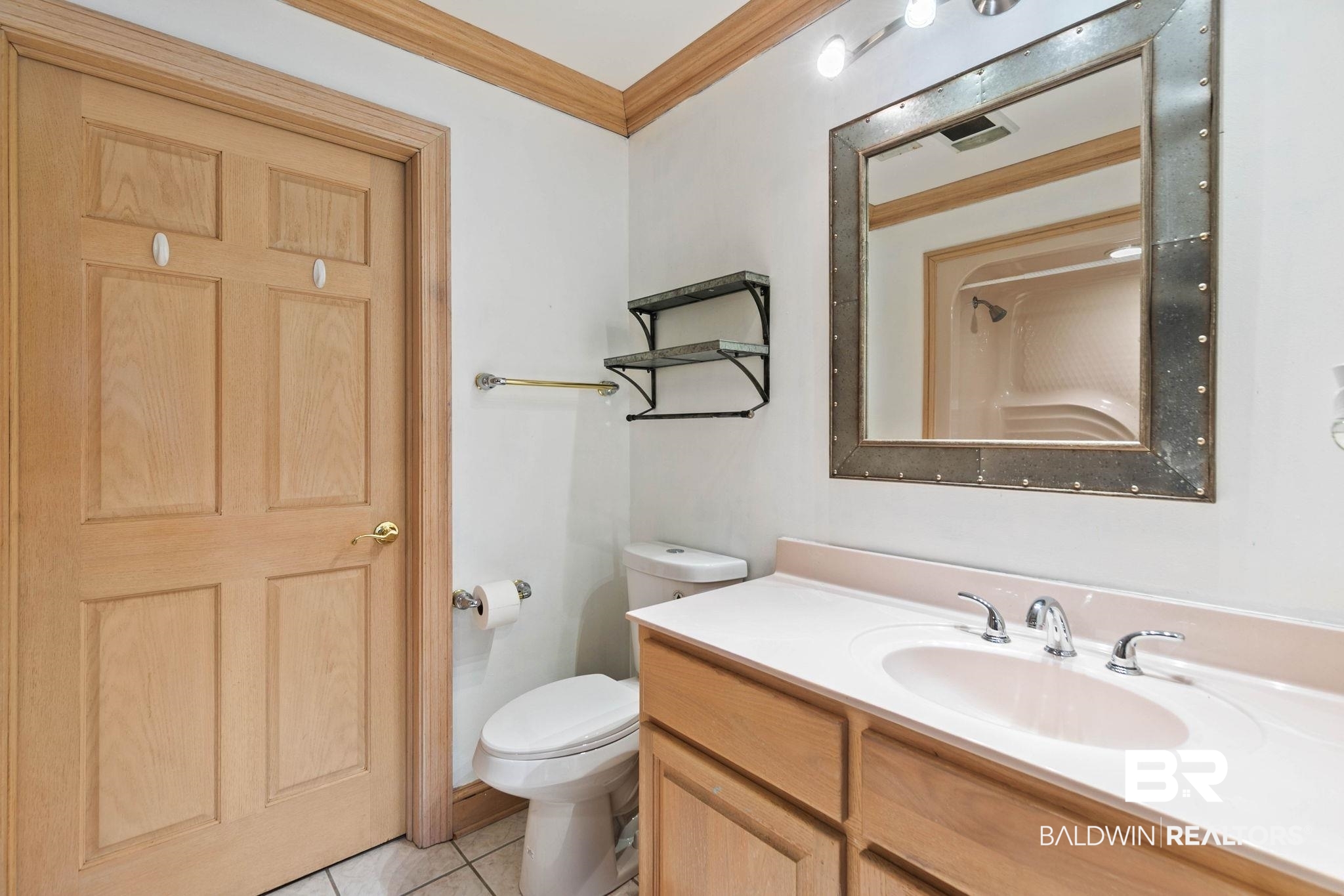2 Speckle Trout Route Daphne, AL 36527 - Photo 28 of 61 Bathroom with ornamental molding, vanity, a shower, and light tile patterned flooring
