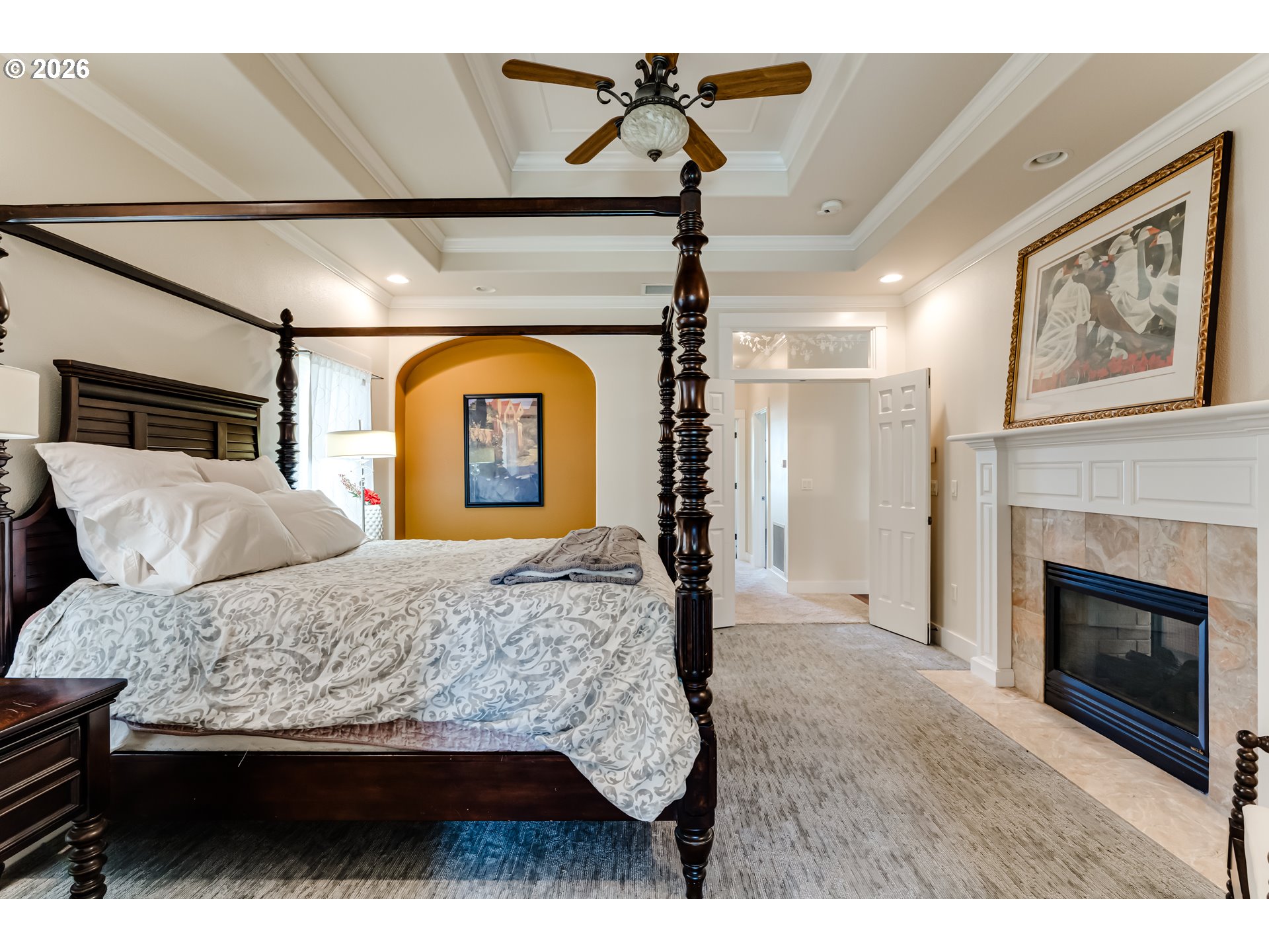 34386 Mathews Road Eugene, OR 97405 - Photo 37 of 48 a bedroom with a large bed and a fireplace