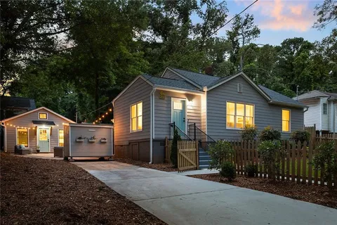 a front view of a house with yard