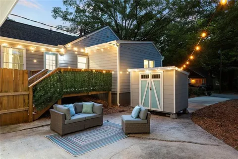 a view of a patio with couches and a fire pit