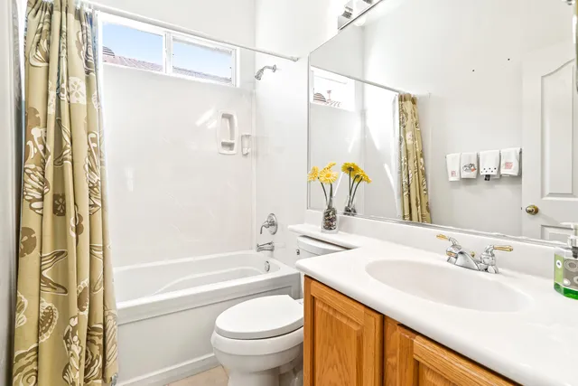 a view of house with backyard