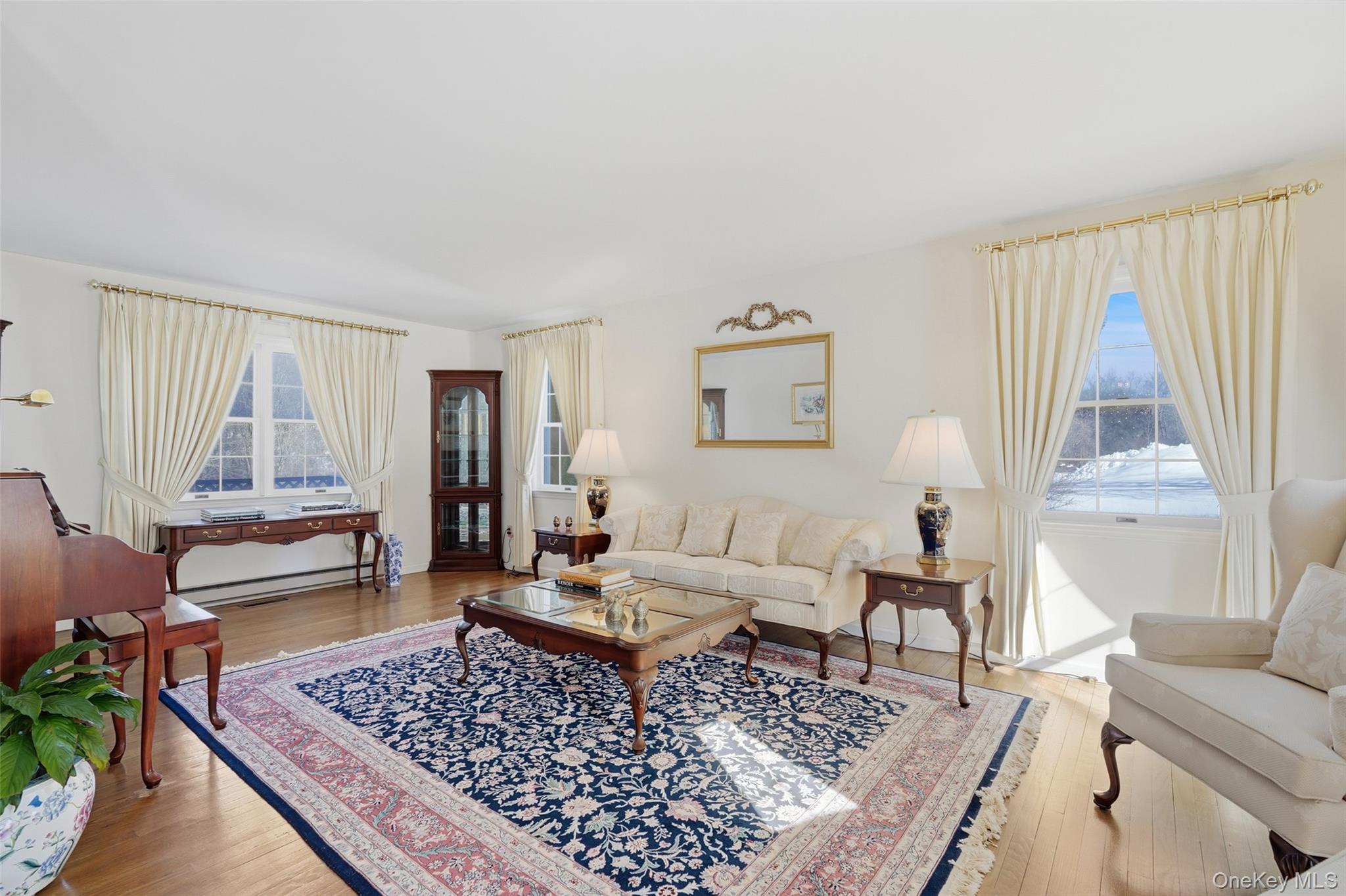 2 Cheyenne Court Katonah, NY 10536 - Photo 3 of 21 Living room with oversized windows bringing Nature in.
