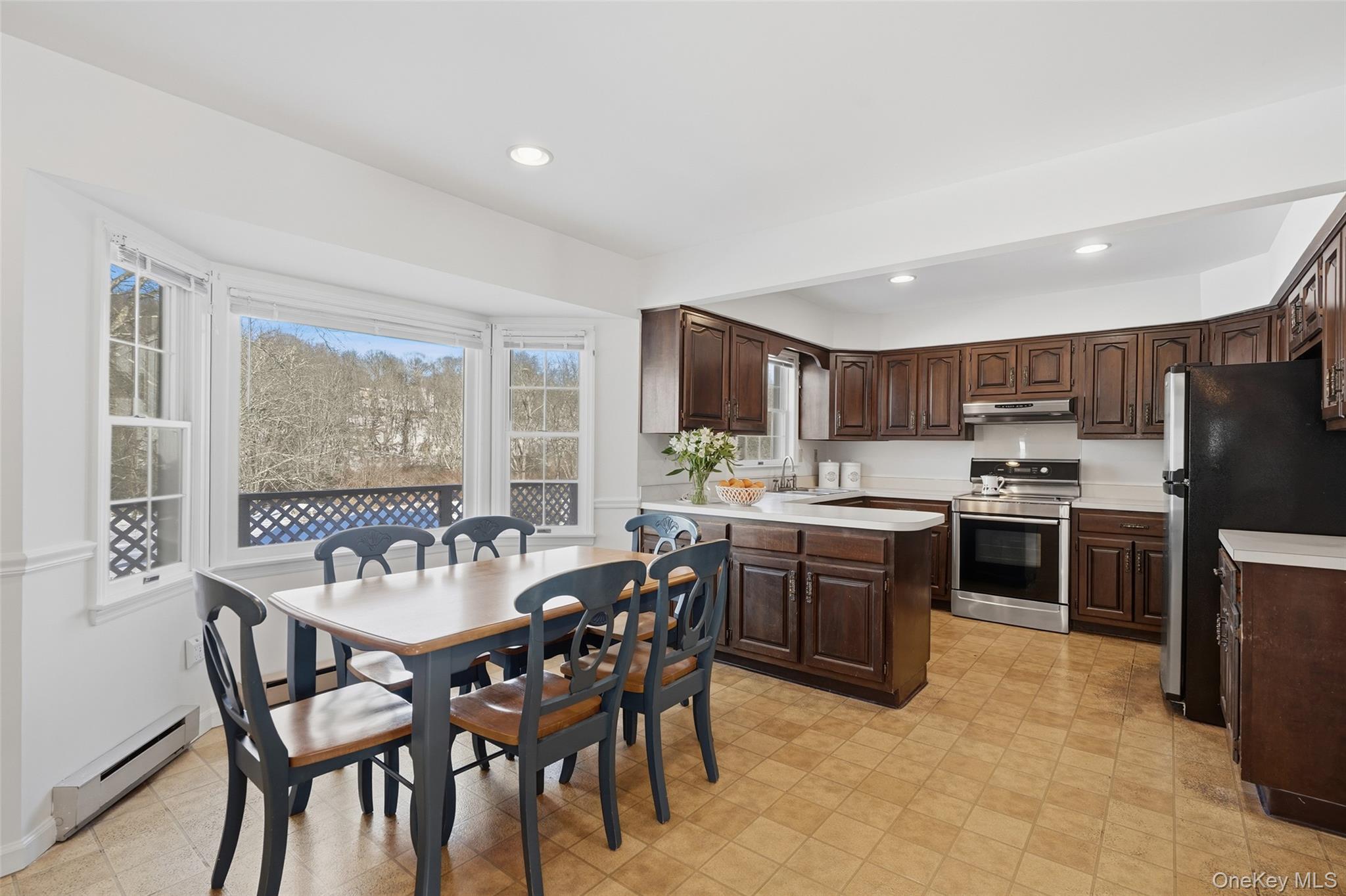 2 Cheyenne Court Katonah, NY 10536 - Photo 5 of 21 Eat in kitchen with large picture window overlooking deck and expansive backyard.