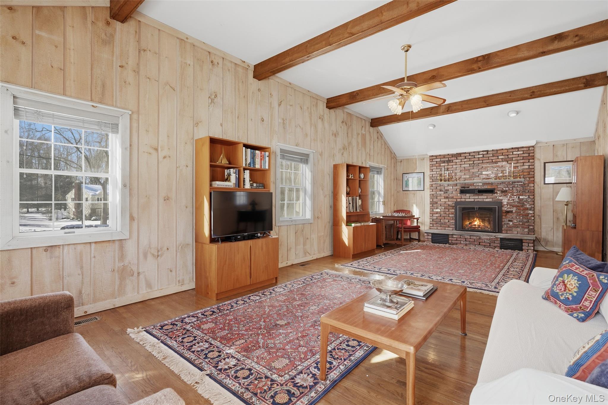 2 Cheyenne Court Katonah, NY 10536 - Photo 8 of 21 Family room with gas fireplace and vaulted ceiling.