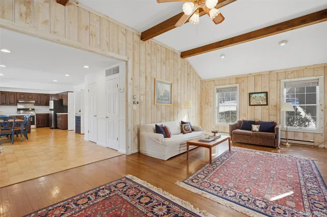 a view of an empty room with a cabinet and a window