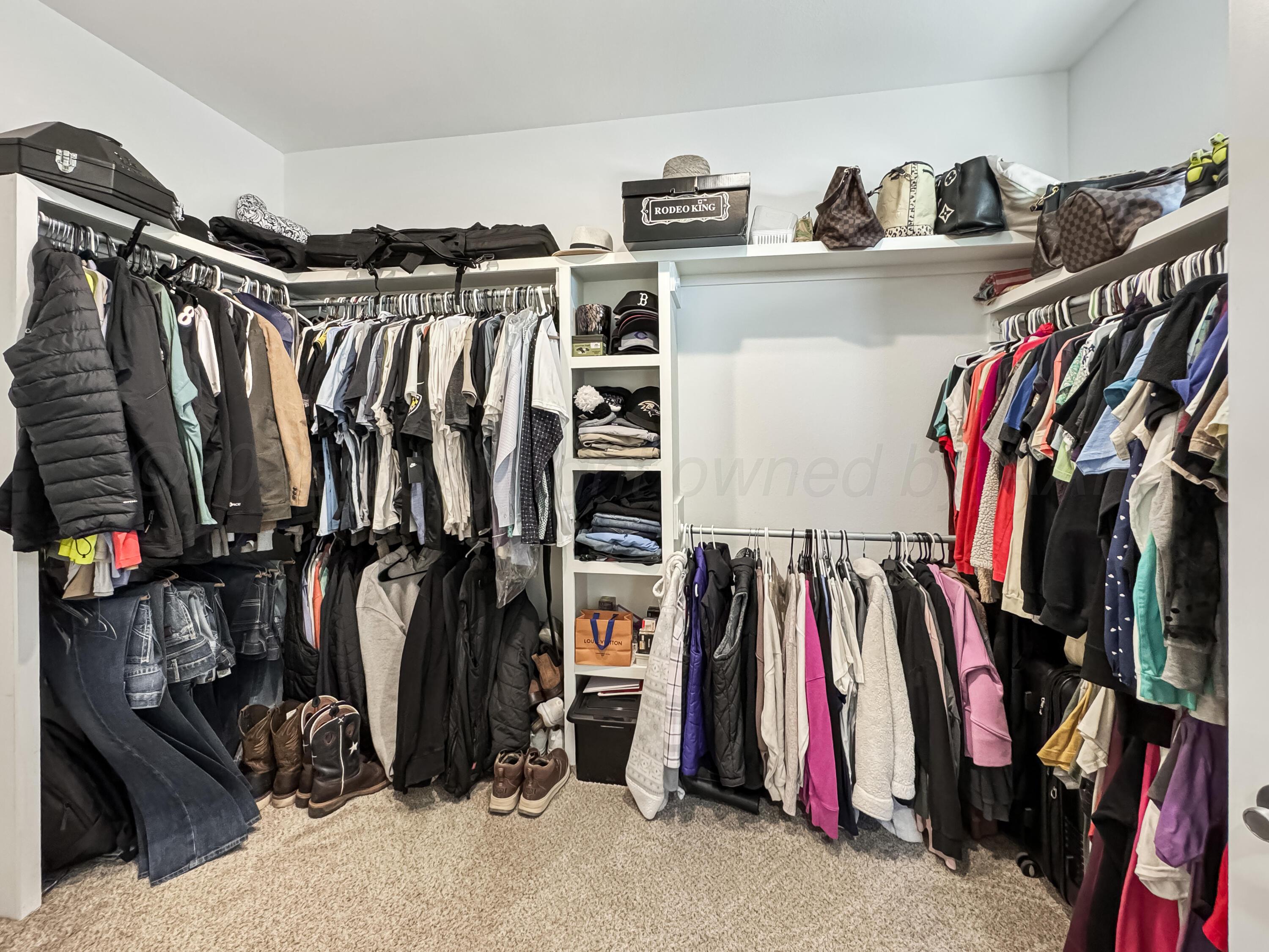 18300 Taurus Trail Canyon, TX 79015 - Photo 16 of 32 a view of walk in closet with clothes and shoes