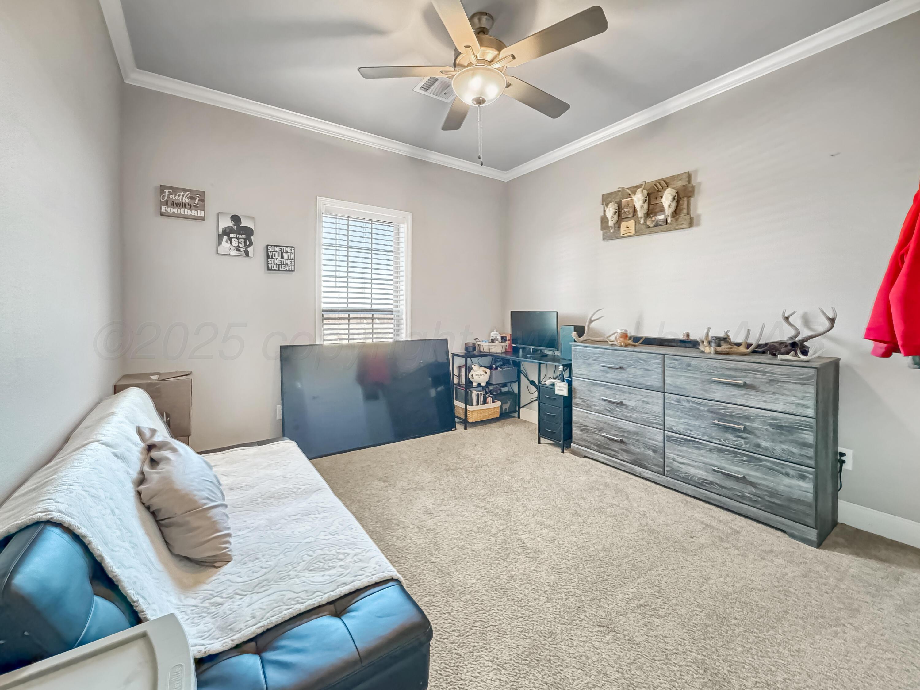 18300 Taurus Trail Canyon, TX 79015 - Photo 19 of 32 a bedroom with a bed and ceiling fan