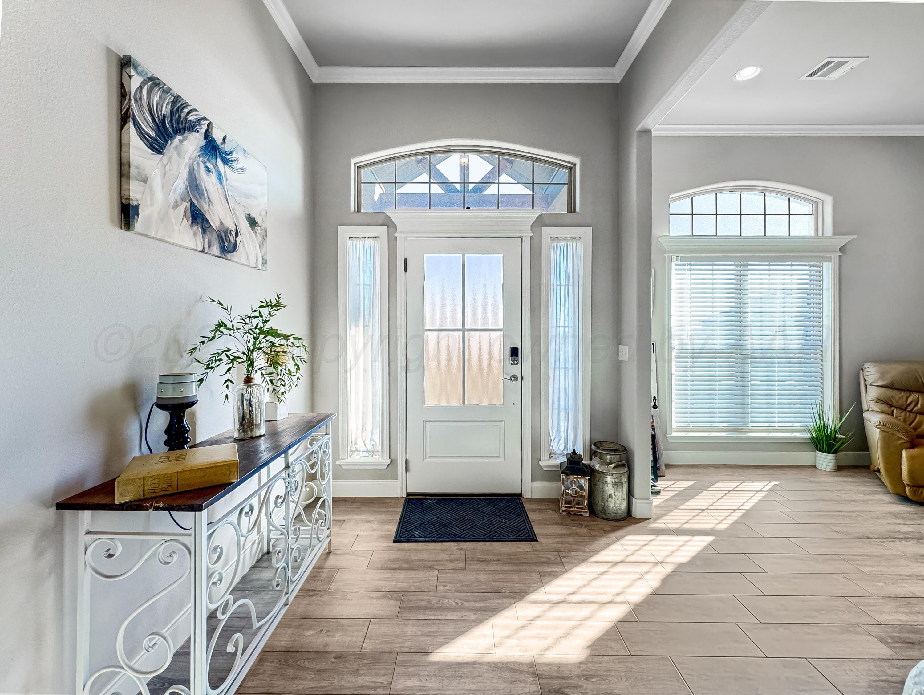 18300 Taurus Trail Canyon, TX 79015 - Photo 2 of 32 a view of an entryway with wooden floor