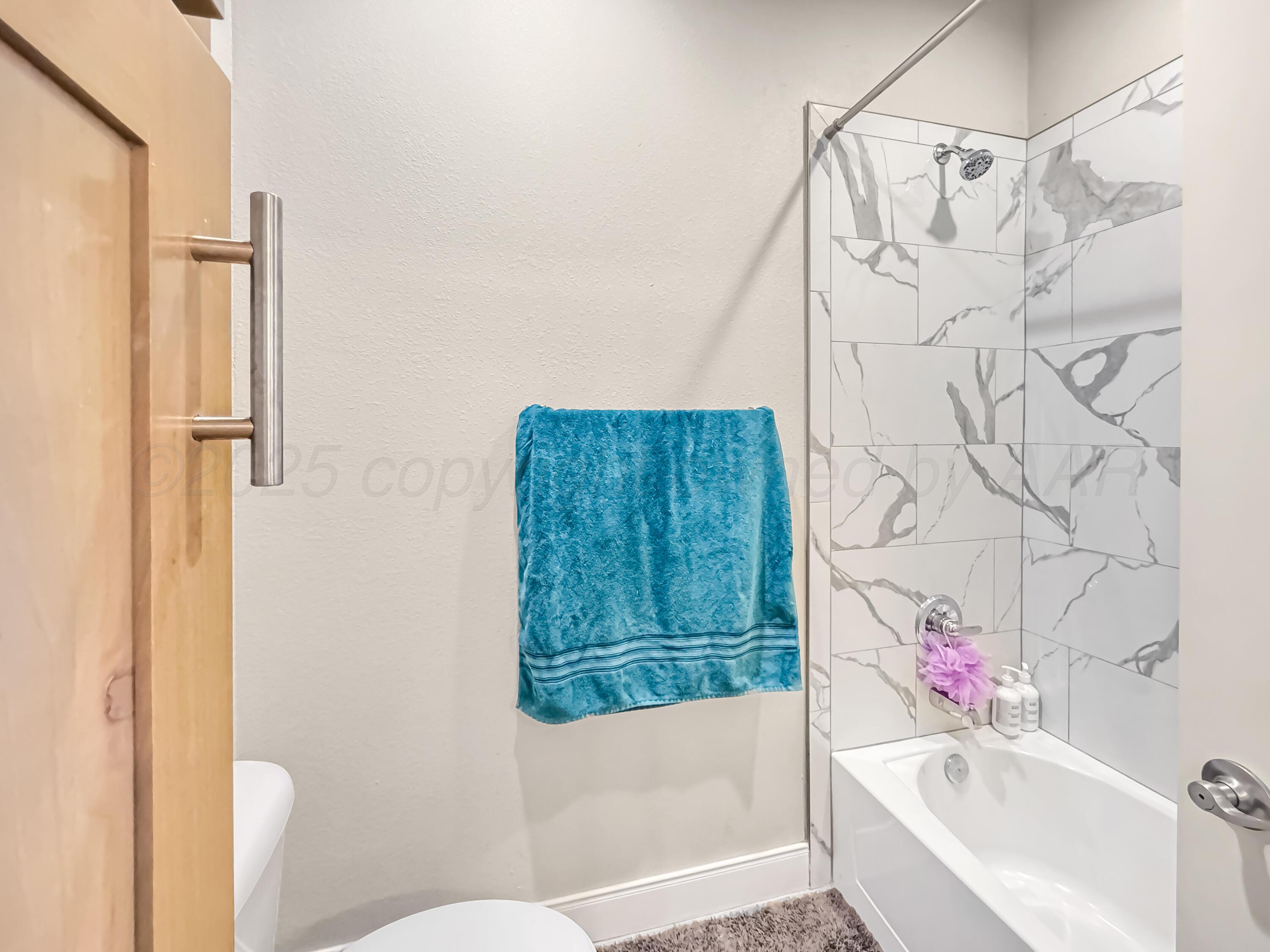 18300 Taurus Trail Canyon, TX 79015 - Photo 21 of 32 a bathroom with a bathtub and shower