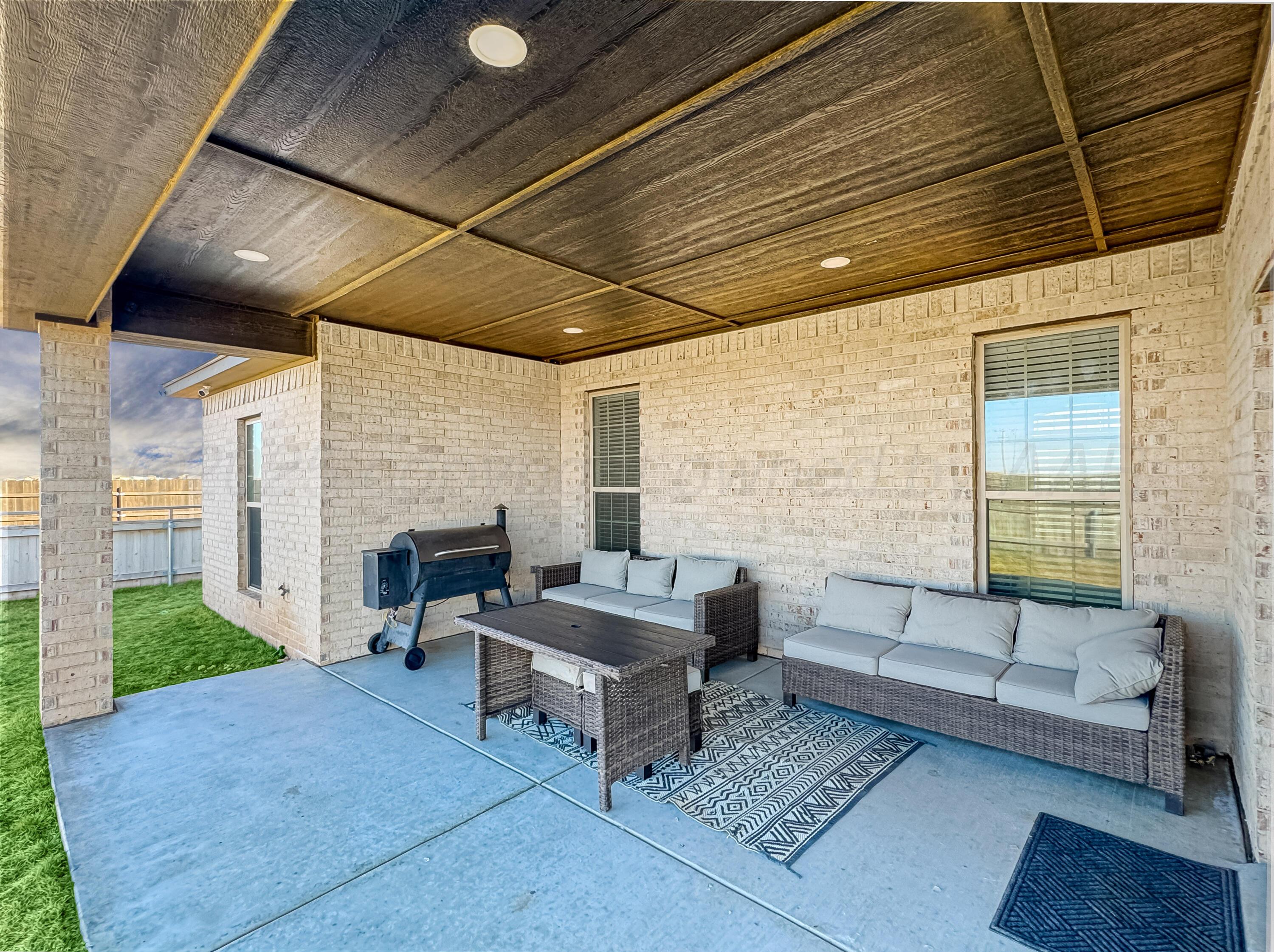 18300 Taurus Trail Canyon, TX 79015 - Photo 24 of 32 a living room with furniture and a fireplace