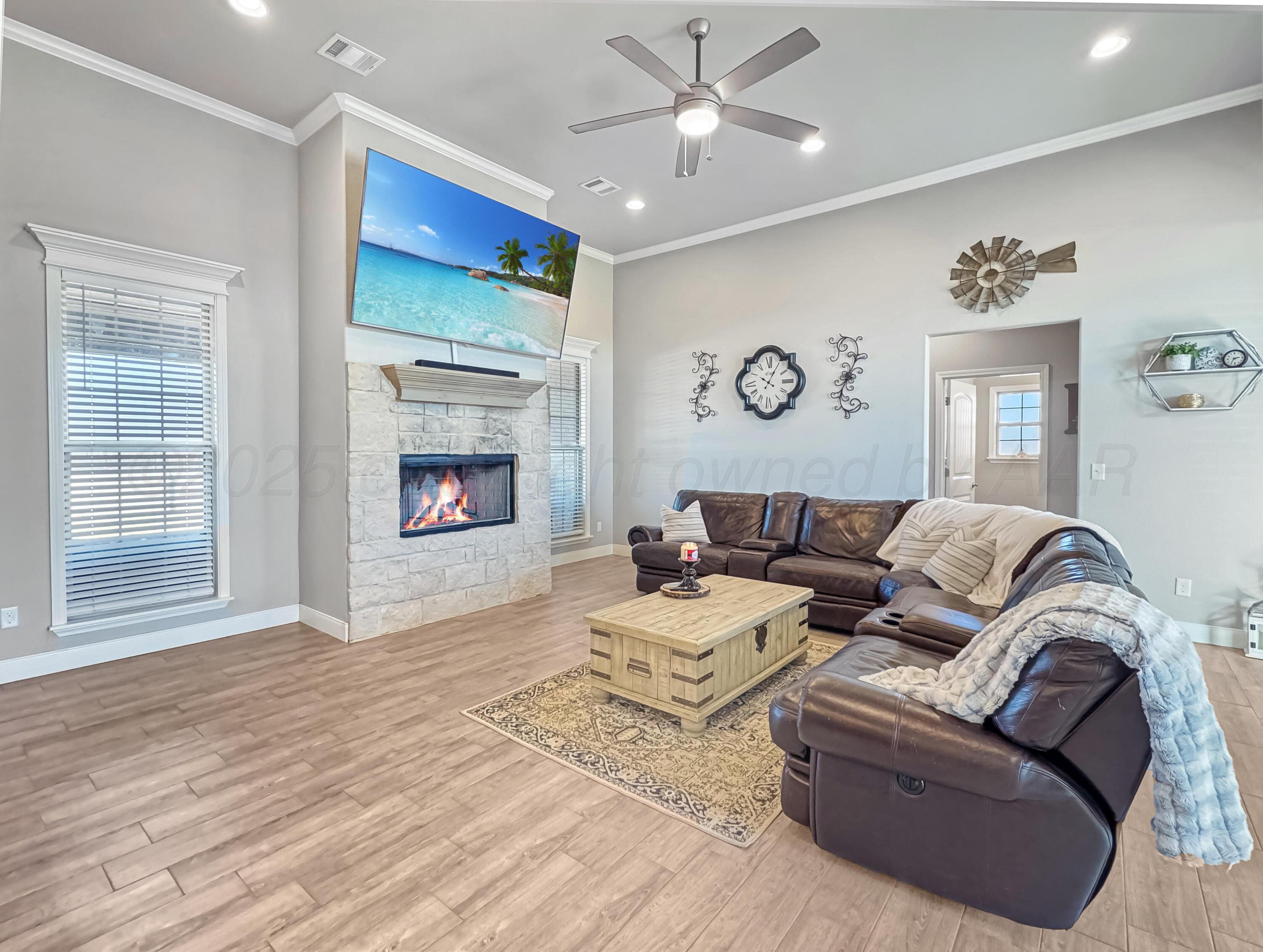 18300 Taurus Trail Canyon, TX 79015 - Photo 7 of 32 a living room with furniture fireplace and a flat screen tv