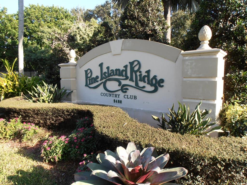 9520 Seagrape Drive, Unit 103 Davie, FL 33324 - Photo 22 of 39 a view of a street with flower plants