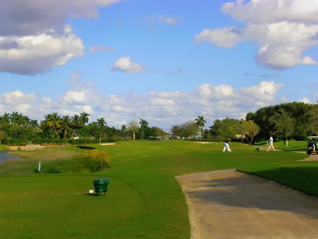 a view of a golf course with a lake