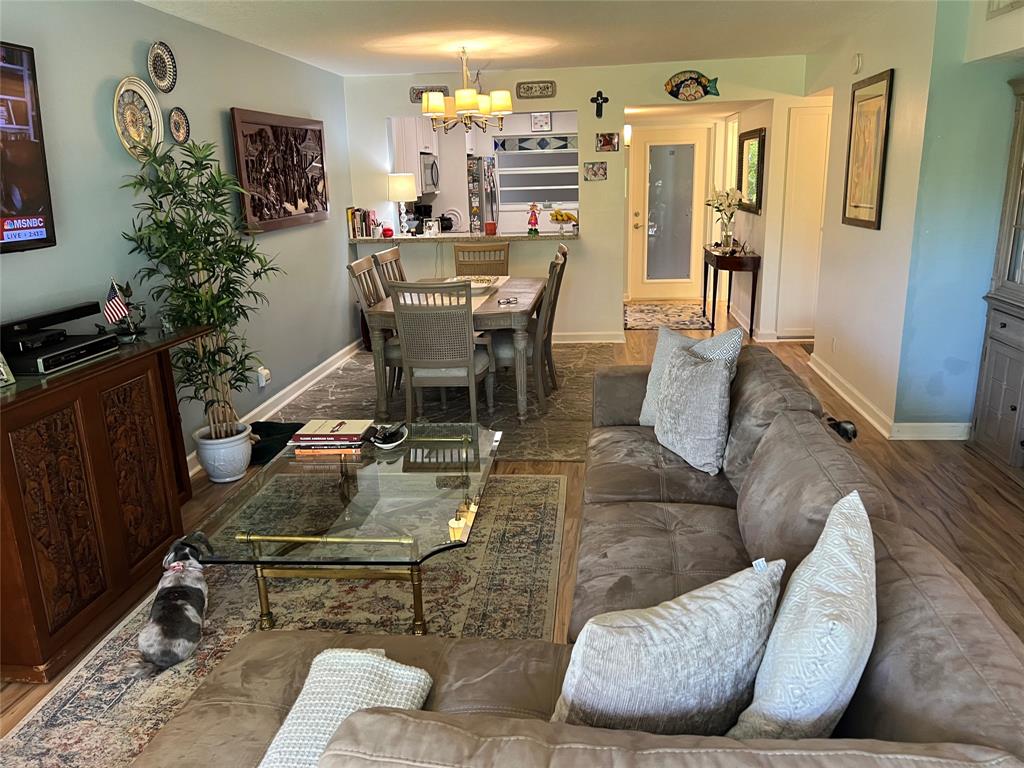 9520 Seagrape Drive, Unit 103 Davie, FL 33324 - Photo 6 of 39 a living room with furniture and wooden floor