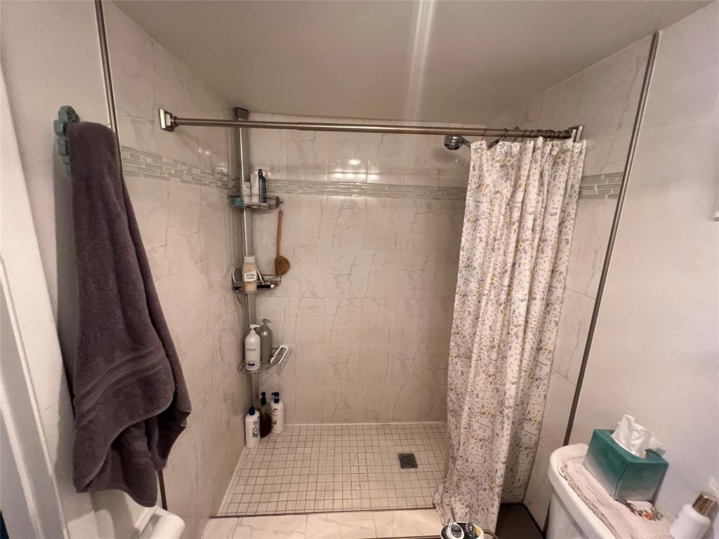 9520 Seagrape Drive, Unit 103 Davie, FL 33324 - Photo 9 of 39 a bathroom with a shower