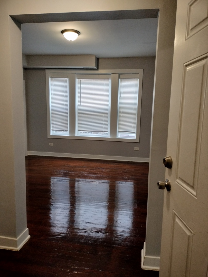 6603 South Bishop Street, Unit 66032 Chicago, IL 60636 - Photo 2 of 19 a view of wooden door