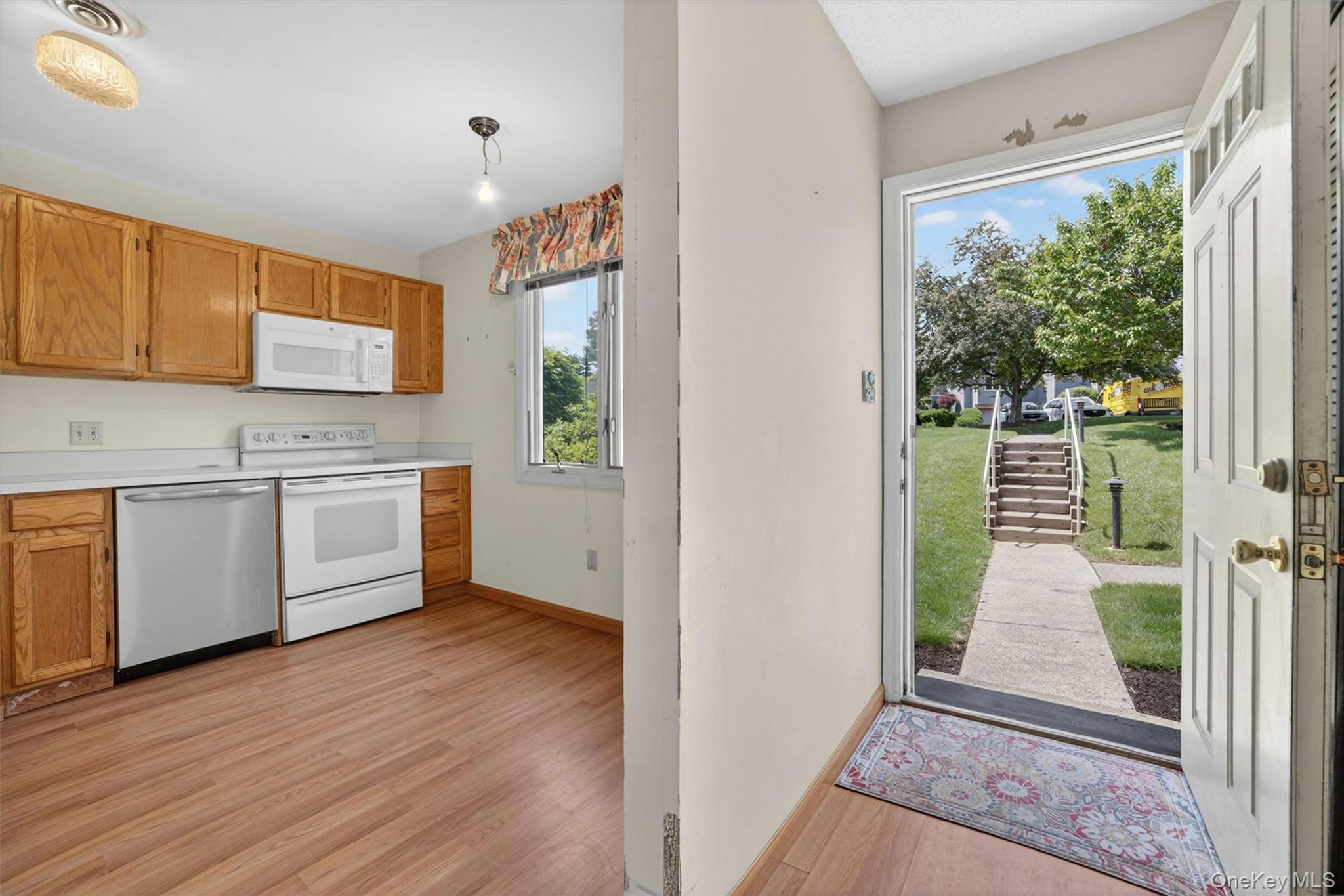 116 Fields Lane Peekskill, NY 10566 - Photo 5 of 40 a view of a kitchen with microwave and cabinets