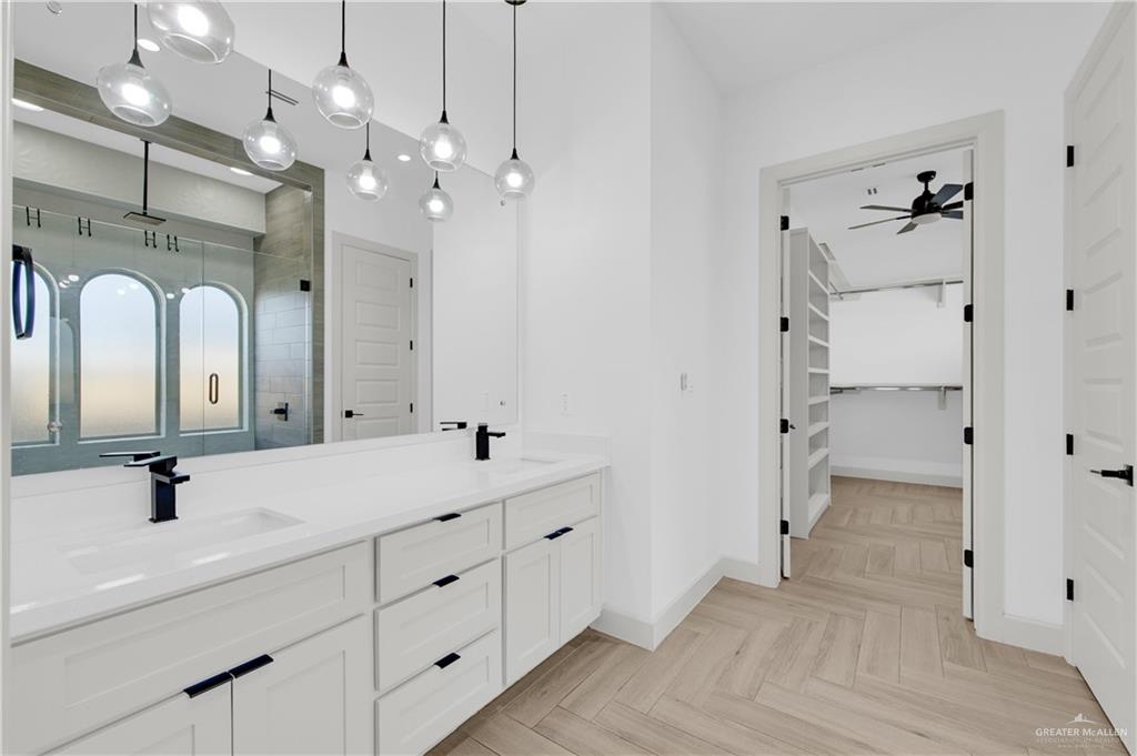 1515 Duke Street Mission, TX 78572 - Photo 19 of 33 a bathroom with a double vanity sink mirror and shower