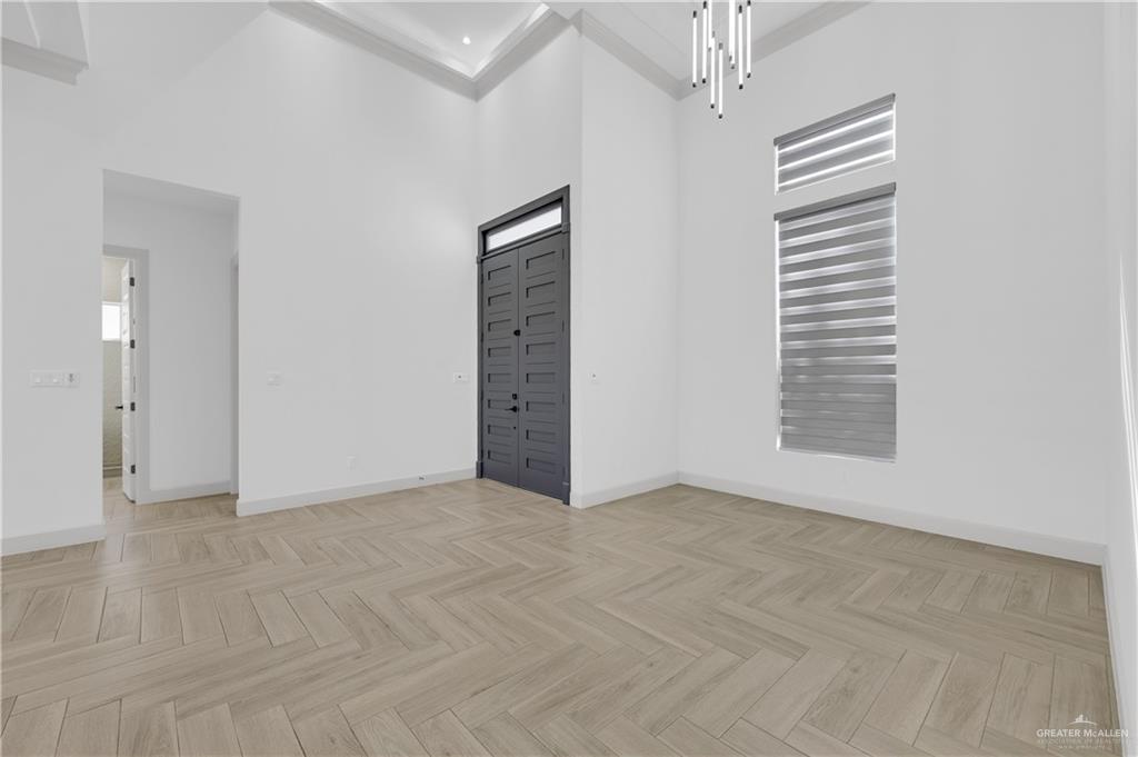 1515 Duke Street Mission, TX 78572 - Photo 3 of 33 an empty room with windows and cabinet