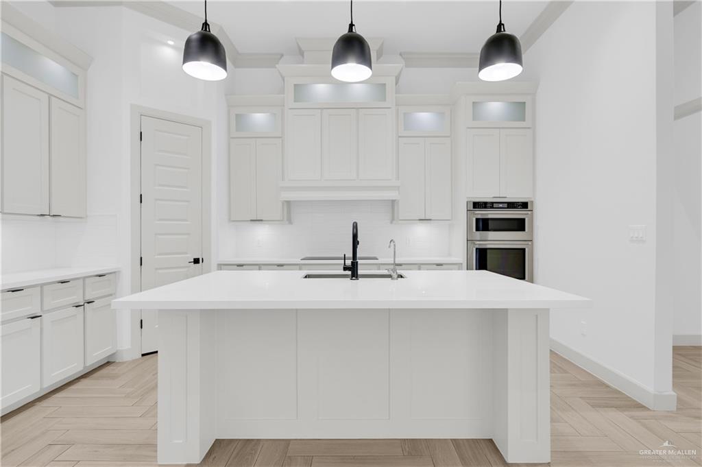 1515 Duke Street Mission, TX 78572 - Photo 10 of 33 a kitchen with stainless steel appliances a sink and cabinets