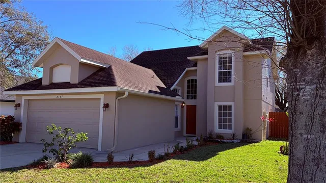 front view of a house with a yard