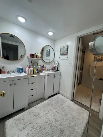 a kitchen with sink cabinets and refrigerator