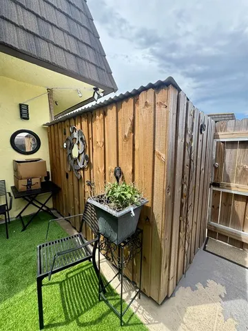 a view of swimming pool with seating space