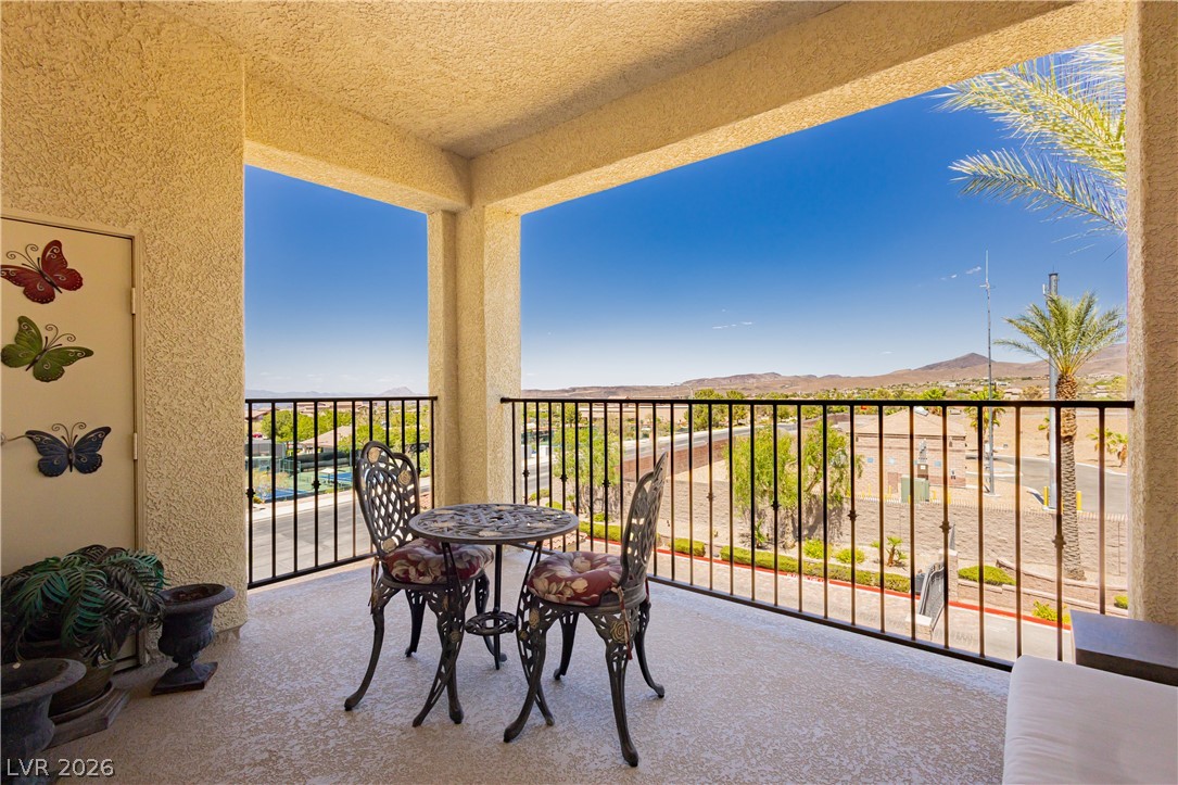 2555 Hampton Road, Unit 3308 Henderson, NV 89052 - Photo 24 of 65 A spacious balcony overlooks desert vistas and offers an inviting outdoor seating area for relaxation.