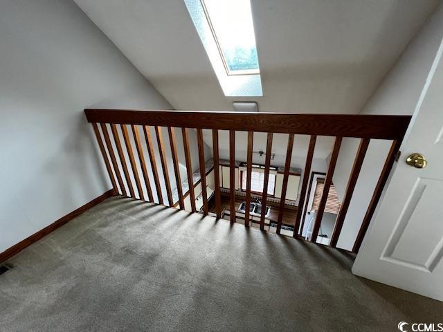 310 Lakeside Drive, Unit A Surfside Beach, SC 29575 - Photo 13 of 13 Staircase with dark colored carpet and vaulted cei