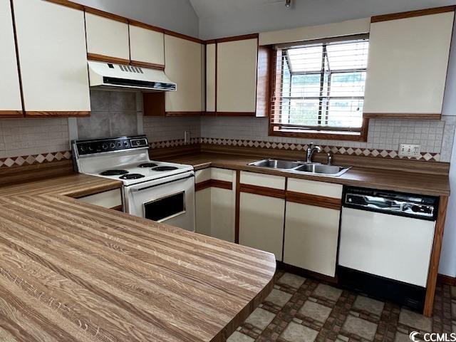 310 Lakeside Drive, Unit A Surfside Beach, SC 29575 - Photo 3 of 13 Kitchen featuring sink, white cabinetry, tasteful