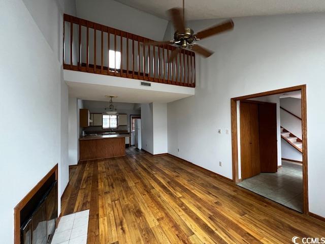 310 Lakeside Drive, Unit A Surfside Beach, SC 29575 - Photo 4 of 13 Unfurnished living room with ceiling fan, hardwood