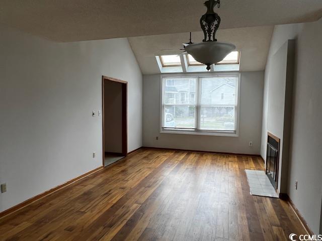 310 Lakeside Drive, Unit A Surfside Beach, SC 29575 - Photo 5 of 13 Interior space featuring vaulted ceiling with skyl