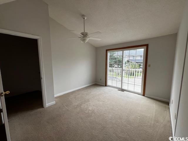 310 Lakeside Drive, Unit A Surfside Beach, SC 29575 - Photo 9 of 13 Spare room with carpet floors, a textured ceiling,