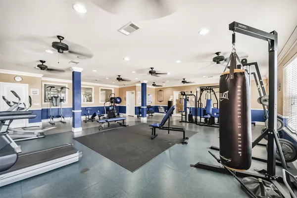 a view of a building with garden and sitting area