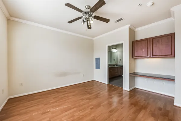 a bathroom with a granite countertop double vanity sink a mirror and a bathtub