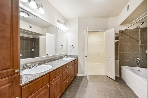 a bath tub sitting next to a shower