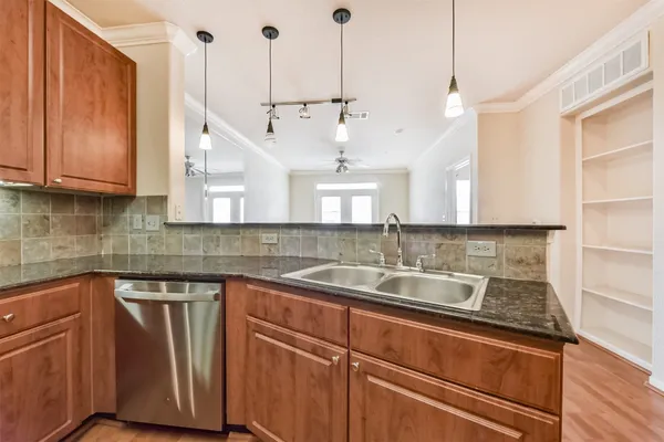 a kitchen with wooden cabinets and a stove top oven
