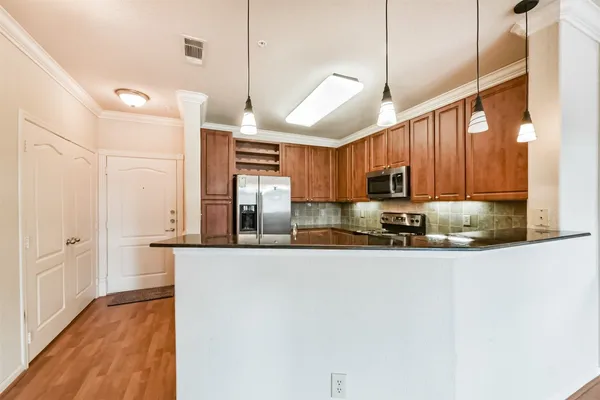 a bathroom with a granite countertop sink mirror and