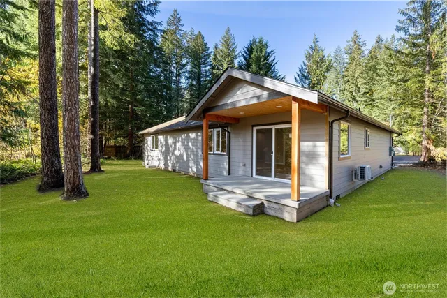 a view of backyard with a garden and entertaining space