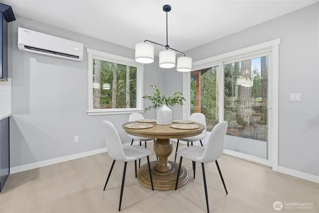 a view of a dining room with furniture window and outside view