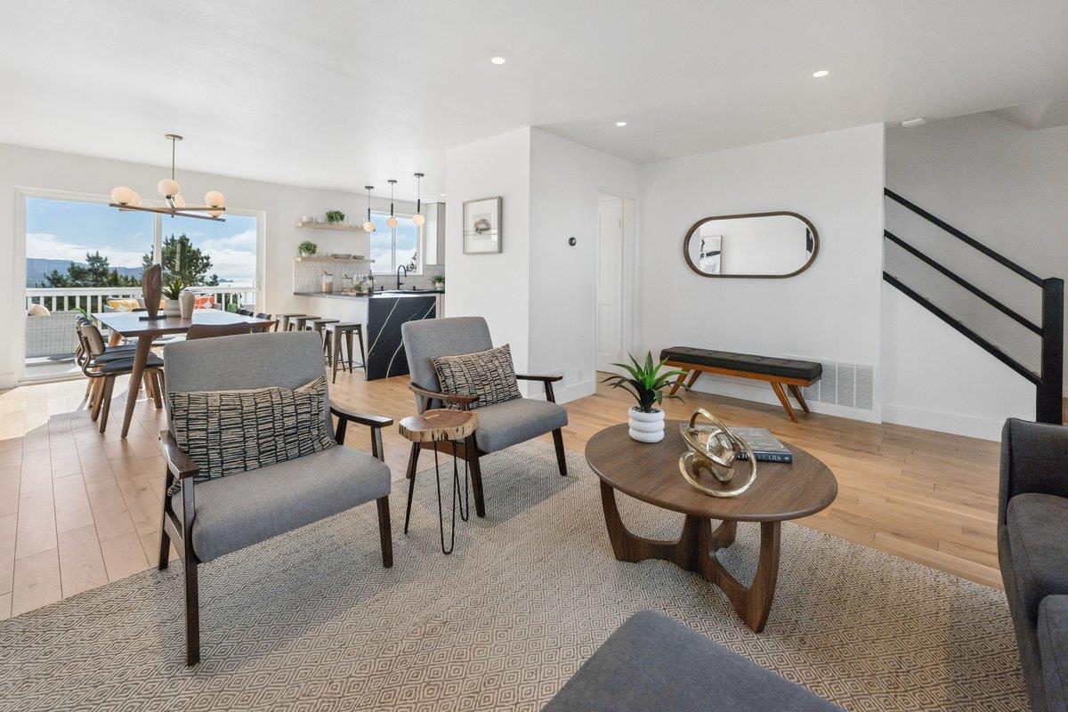 170 Beachview Avenue Pacifica, CA 94044 - Photo 35 of 85 a dining room with furniture a wooden floor and a table