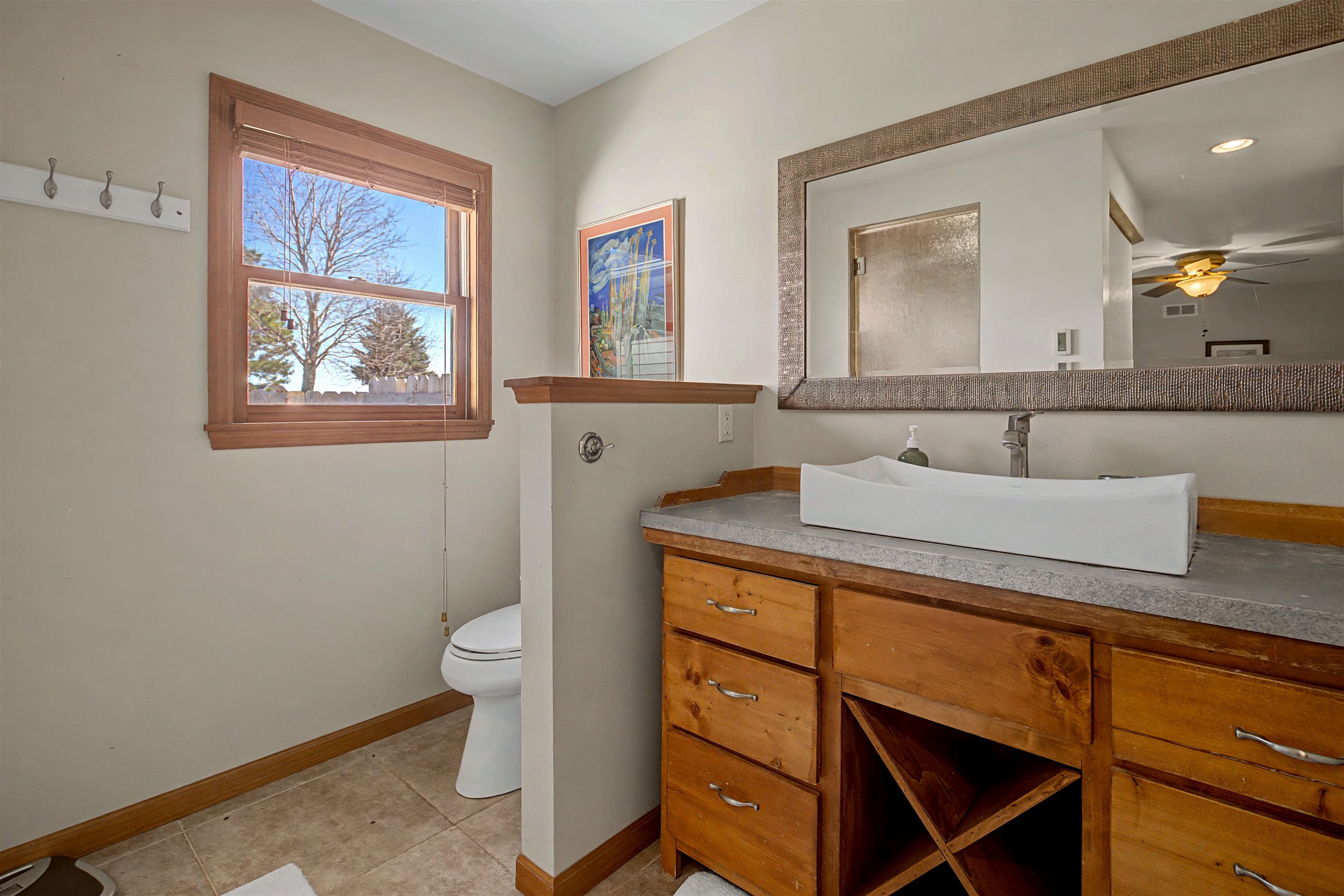 115 Windmill Road Elizabeth, IL 61028 - Photo 21 of 66 a bathroom with a toilet sink and mirror