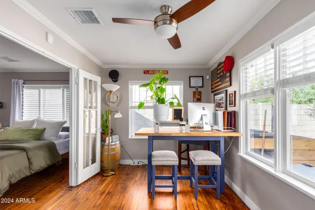 a view of a dining room with furniture and a window