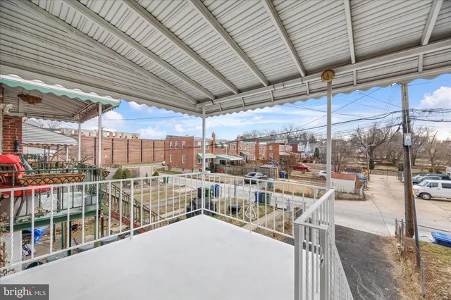 a view of a swimming pool with outdoor seating