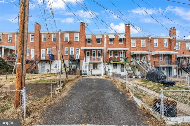 a view of a building with a yard
