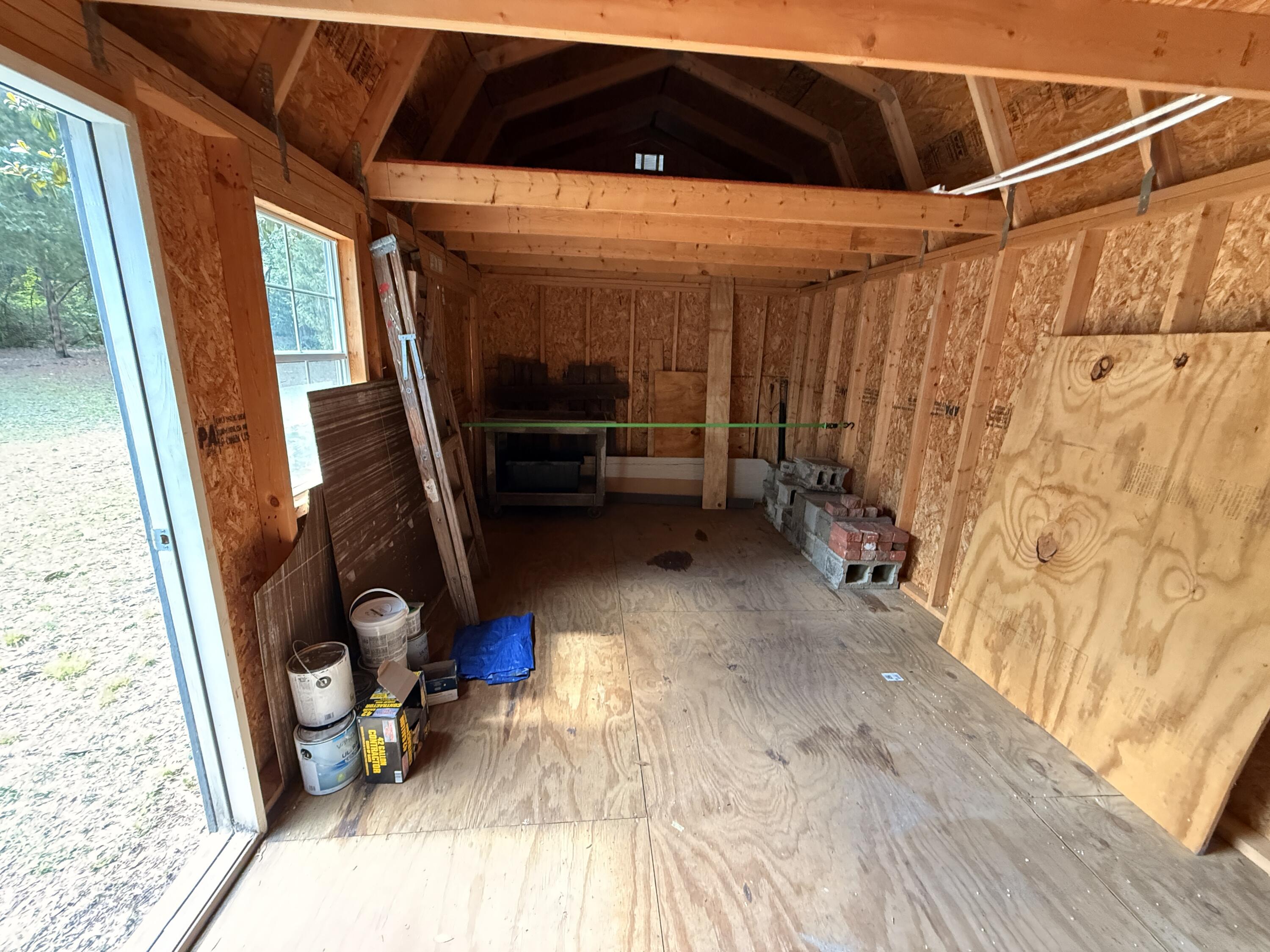 299 Carl Place Crestview, FL 32539 - Photo 11 of 37 a view of walk in closet with clothes and shoes