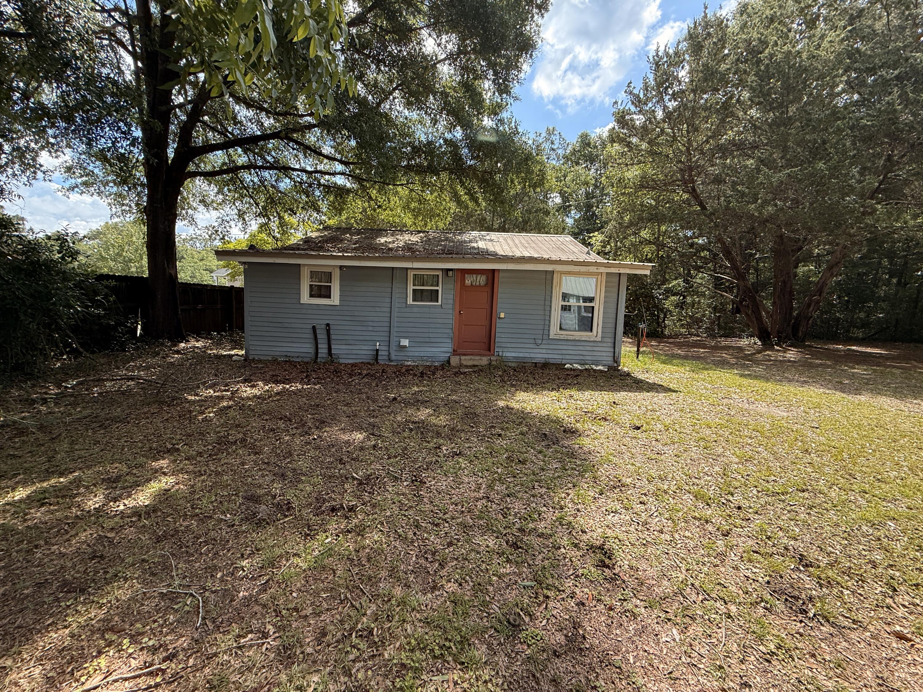 299 Carl Place Crestview, FL 32539 - Photo 12 of 37 a house with trees in front of it