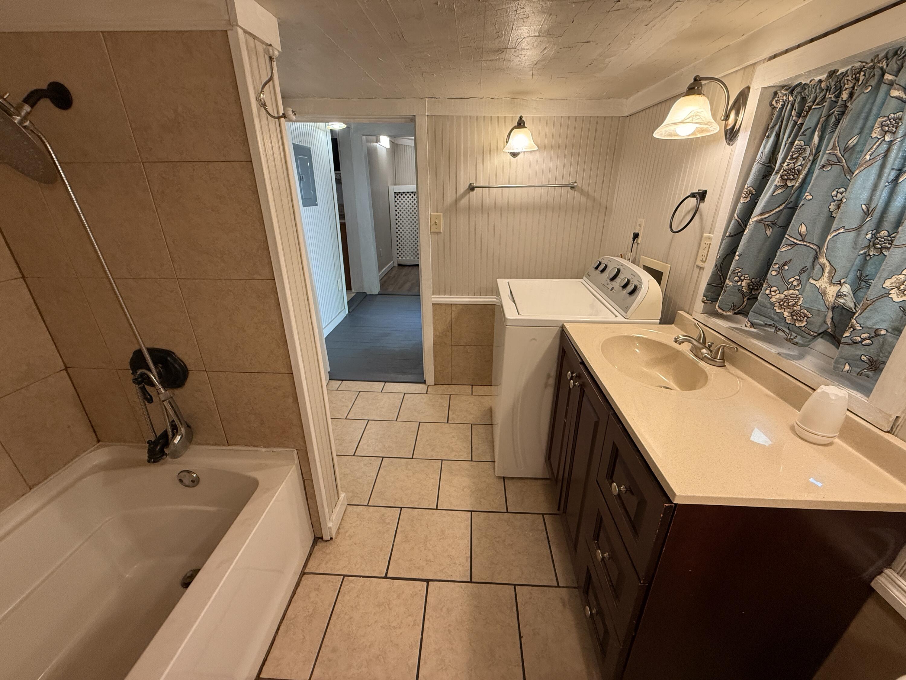 299 Carl Place Crestview, FL 32539 - Photo 15 of 37 a bathroom with a sink and a tub