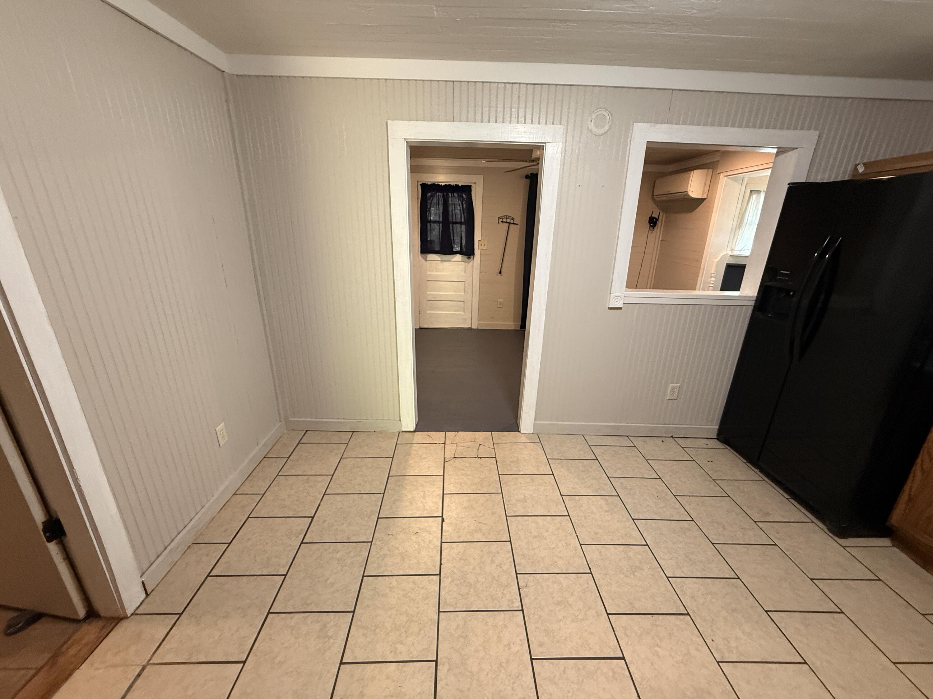 299 Carl Place Crestview, FL 32539 - Photo 19 of 37 a view of an empty room and a bathroom